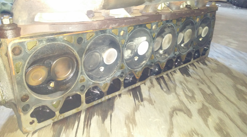 Cylinder one shows clear signs of coolant intrusion.